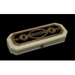 19th Century ivory toothpick case, the hinged cover inset with a gold coloured metal and blue foil
