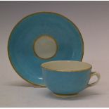 18th Century Worcester tea cup and saucer, each having a gilt highlighted turquoise glaze, crossed