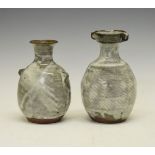 Two Janet Leach studio pottery baluster shaped vases, each having a mottled grey glaze, impressed