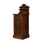 Edwardian carved walnut bedside cupboard having a raised back fitted an open shelf, carved fielded