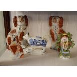 Pair of 19th Century Staffordshire pottery comforter spaniels having red patched decoration, a