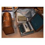 Two vintage typewriters and a sewing machine Condition: