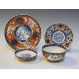 Imari porcelain bowl and cover, two similar plates Condition:
