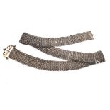 Lady's white metal woven belt having a pierced clasp, 74cm long Condition: