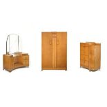 Art Deco oak three piece bedroom suite comprising: two door wardrobe, drop-centre dressing table