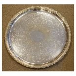 Late 19th/early 20th Century engraved silver plated circular tray having a cast rim Condition: