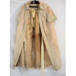 Late 19th/early 20th Century lady's beige cotton cape embroidered with foliate sprigs and having