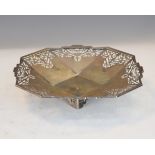 George VI silver octagonal dish having pierced decoration and standing on conforming bracket feet,