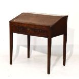 George III oak desk having a rising slope, one long drawer below and standing on tapered square