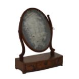 19th Century mahogany oval dressing table mirror, the box base fitted three drawers Condition: