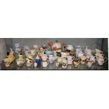 Large collection of decorative cream jugs together with a tea pot with hunting decoration in