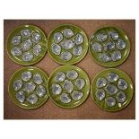 Six French pottery oyster dishes having mottled grey/blue decoration on a green ground Condition: