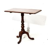 Victorian mahogany rectangular snap-top wine table standing on a turned pillar and tripod base