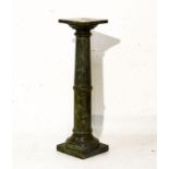 Mottled green finish wooden torchère having a fluted column and standing on a square foot Condition: