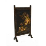 Early 20th Century black lacquered fire screen having chinoiserie style polychrome decoration