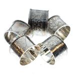 Five silver napkin rings to include a set of four hallmarked Birmingham 1912, total weight 2.5oz