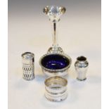 Small group of silver items comprising: cauldron salt, trumpet bud base, napkin ring, pepperette and