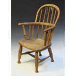 19th Century child's ash and elm low hoop back Windsor elbow chair standing on turned supports