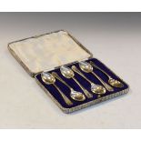 Golfing Interest - Cased set of six George V silver teaspoons, each with crossed golf clubs to