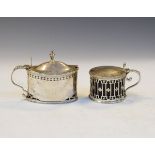 Two silver mustard pots, the first London 1786 of oval form, the second Birmingham 1909 of pierced