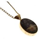 9ct gold trimmed oval pendant inset with two coloured hardstone panels, together with curb link
