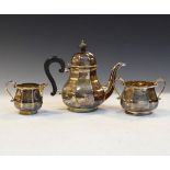 George V three piece silver tea service of Queen Anne style and octagonal bulbous shape