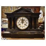 Late 19th Century ebonised cased architectural style mantel clock, the white enamel dial with