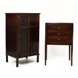 Dark mahogany music chest fitted three fall front drawers and standing on tapered square supports