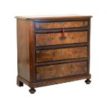 19th Century Continental mahogany and walnut chest, the four drawers with ebonised banding and