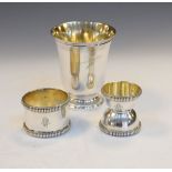 Three items of French silver comprising: a footed christening cup, a napkin ring of heavy gauge