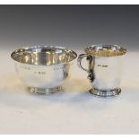 George VI silver christening mug of bell shape on foot, Sheffield 1945, together with a silver bowl,