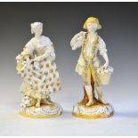 Pair of late 19th/early 20th Century German porcelain figures depicting a gallant and lady, 23.5cm