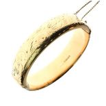 9ct gold sleeved hinged bangle, 25g gross approx Condition: