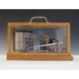 Barograph in a light oak case Condition: