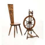 19th Century fruitwood spinning wheel, together with an early 20th Century carved oak spinning chair