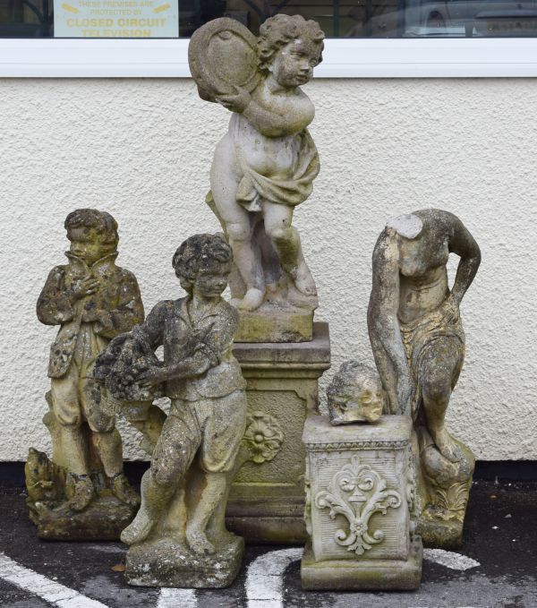 Four modern 'stone' garden figures Condition: