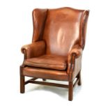 Good quality reproduction Georgian style wing back library chair, upholstered in studded hide