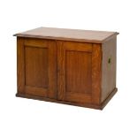 Early 20th Century oak canteen box fitted three drawers enclosed by a pair of panelled doors,