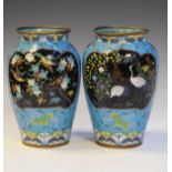 Pair of Japanese cloisonné ovoid vases, Meiji period, each having two reserves depicting storks
