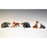 Three Beswick figures of Badgers No's 3392, 3393 and 3394, together with two Beswick figures of