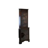 20th Century Georgian style mahogany two section standing corner cabinet, the upper section fitted