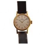 Omega De Ville lady's gold plated cased wristwatch having a leather strap, with original case, outer