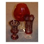 Early 20th century bohemian ruby flash glass urn shaped vase, standing on a circular foot, another