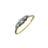 Yellow metal three stone diamond dress ring, stamped 18ct, size O½, 2.7g approx Condition: