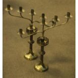 Pair of early 20th Century brass altar style five branch candelabra, each having a castellated