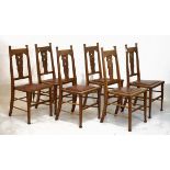 Set of six early 20th Century oak Arts & Crafts side chairs, each having a stuffed seat and standing