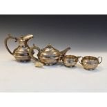 George V silver four piece tea service comprising: teapot, hot water jug, two handled sugar basin
