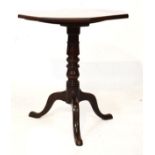 Mahogany octagonal topped wine table on a turned pillar and tripod base Condition: