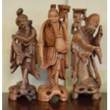 Three Chinese carved wooden figures, the tallest 30.5cm Condition: