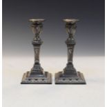 Pair of Edwardian silver pillar candlesticks, each of square design, hallmarked Sheffield 1904